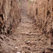 Trench dug in clay soil